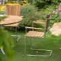 Mllan utegrupp i teak: 4 st karmstolar med matbord 110 cm